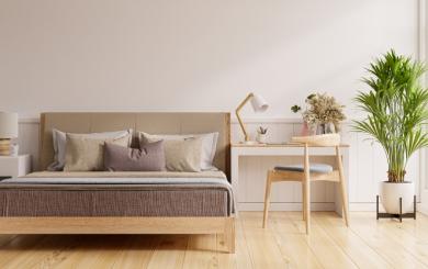 A modern, minimalistic bedroom decorated with beige tones 