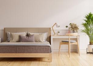 A modern, minimalistic bedroom decorated with beige tones 